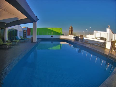 Outdoor pool, open 8:30 AM to 8:00 PM, sun loungers
