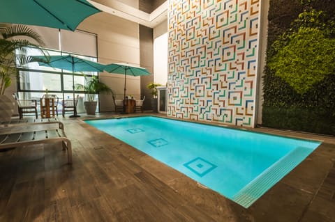 Outdoor pool, open 9:00 AM to 9:00 PM, sun loungers