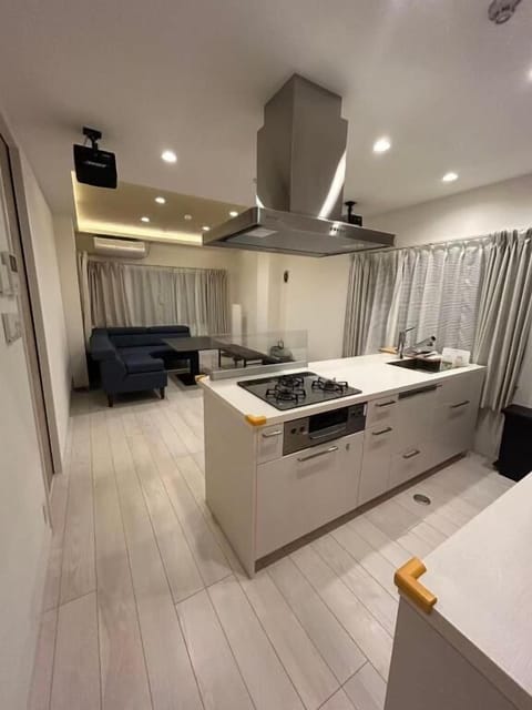 Superior Suite, 3 Bedrooms, Balcony | Private kitchen | Fridge, microwave, oven, stovetop