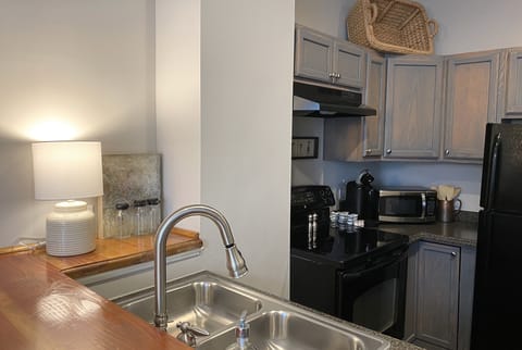 Room, 1 Queen Bed (The Lucile) | Private kitchen | Coffee/tea maker