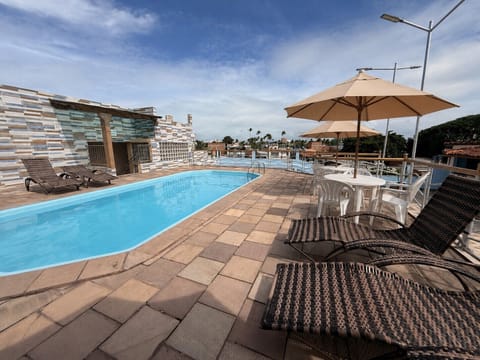 Outdoor pool, open 8:00 AM to 6:00 PM, pool umbrellas, sun loungers