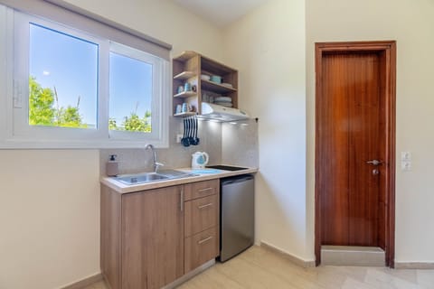 Apartment | Private kitchen | Fridge, cleaning supplies, paper towels
