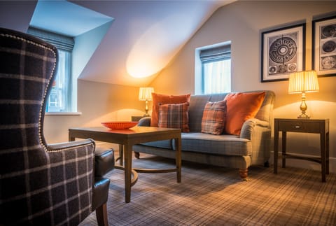 Junior Suite | Living room | 45-inch Smart TV with cable channels