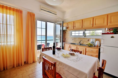 Apartment, 2 Bedrooms | Private kitchen | Fridge, stovetop, coffee/tea maker, electric kettle