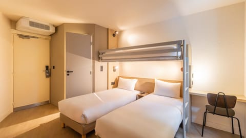 Premium bedding, desk, blackout drapes, soundproofing