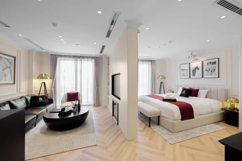 Luxury Suite, Balcony, City View | In-room safe, desk, laptop workspace, blackout drapes