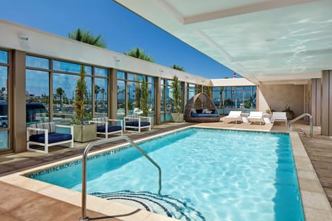 Outdoor pool, open 7:00 AM to 10:00 PM, sun loungers