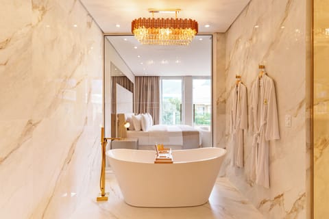 Romantic Suite, Bathtub, Resort View | Bathroom | Hair dryer, towels