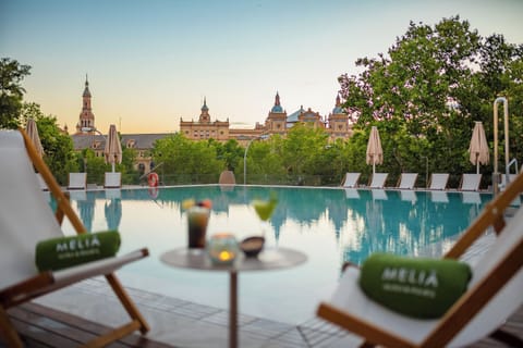Outdoor pool, pool umbrellas, sun loungers