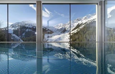 Indoor pool, open 11:00 AM to 7:00 PM, pool umbrellas, sun loungers