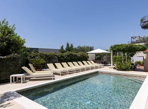 Apartment (Three Bedroom Apartment with Sea View) | Pool | Seasonal outdoor pool, pool umbrellas, sun loungers