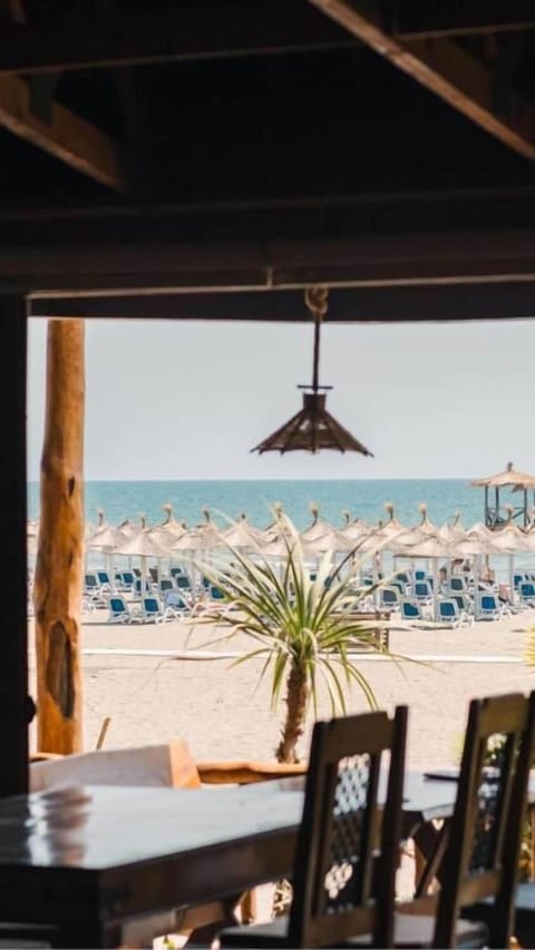 Economy Bungalow, Balcony, Beach View | Outdoor dining