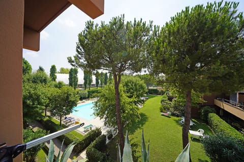 Apartment, Balcony | Pool | Seasonal outdoor pool