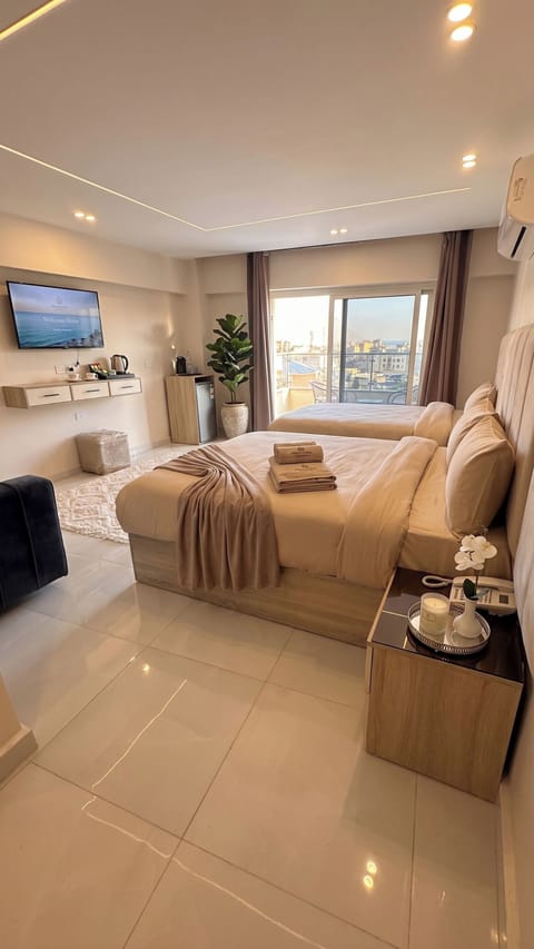 Deluxe Triple Room with Mountain View | Hypo-allergenic bedding available, minibar, in-room safe