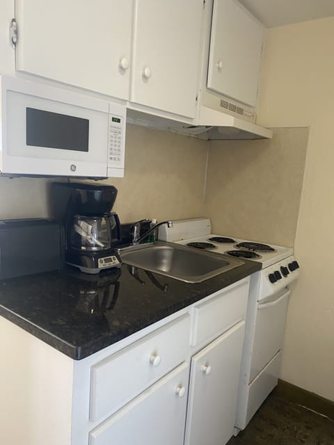 Classic Studio Suite, 2 Queen Beds | Private kitchen | Fridge, microwave, oven, stovetop