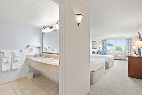 Deluxe Double Queen East View with Tub | Premium bedding, in-room safe, individually decorated, desk