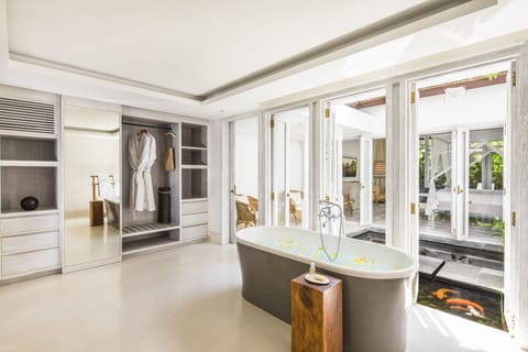 Separate tub and shower, deep soaking tub, designer toiletries