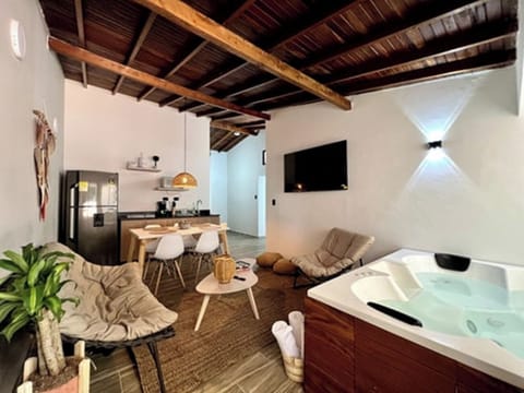 Luxury Apartment, Balcony | Living area | 32-inch flat-screen TV with cable channels