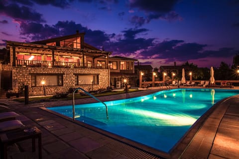 Seasonal outdoor pool, open 9:00 AM to 8:00 PM, pool umbrellas