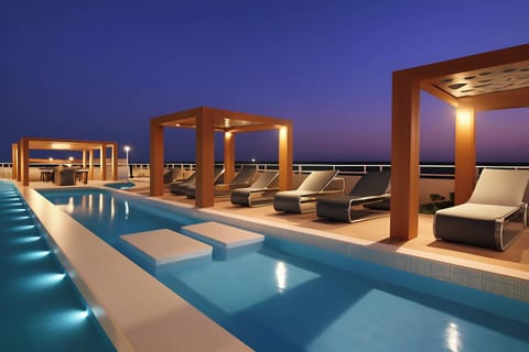 Outdoor pool, pool umbrellas, sun loungers