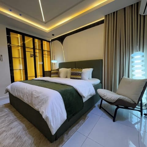 Deluxe Apartment, Balcony, City View | In-room safe, desk, laptop workspace, blackout drapes