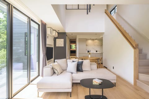 Deluxe Villa | Living area | 55-inch LCD TV with digital channels, streaming services