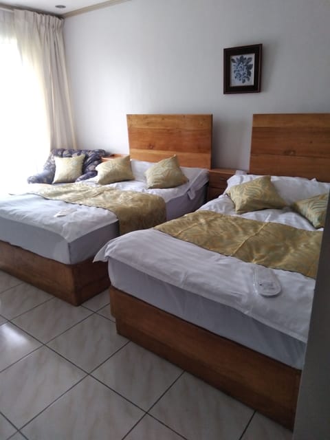 Family Double or Twin Room | Down comforters, WiFi (free), bed sheets