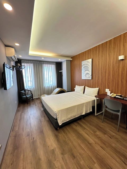 Deluxe Double Room, Non Smoking, City View | In-room safe, desk, laptop workspace, blackout drapes