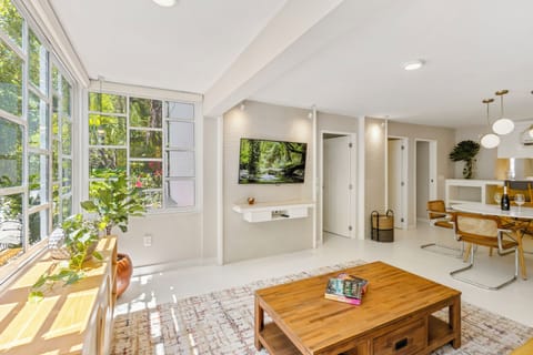 Comfort Condo | Living area | 55-inch flat-screen TV with satellite channels, Netflix, pay movies