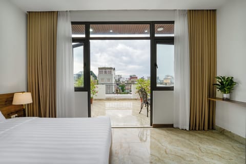 Family Suite, City View | Minibar, desk, laptop workspace, blackout drapes