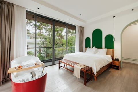 Luxury Suite, Balcony, Garden View | Minibar (some free items), desk, blackout drapes, soundproofing