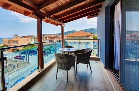 Deluxe Triple Room, Balcony, Sea View | Outdoor dining