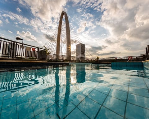 Outdoor pool, open 6 AM to 10 PM, pool umbrellas, sun loungers