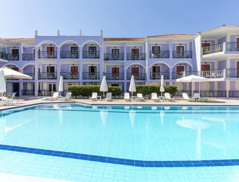 Seasonal outdoor pool, open 10:00 AM to 6:00 PM, pool umbrellas