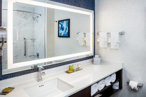 Designer toiletries, hair dryer, bathrobes, towels