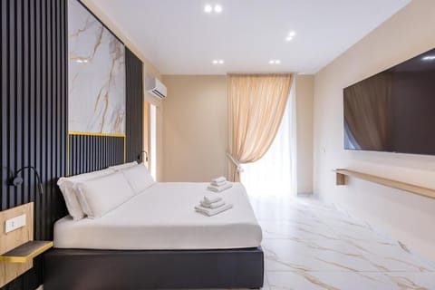 Superior Quadruple Room, City View | Desk, laptop workspace, blackout drapes, WiFi (free)