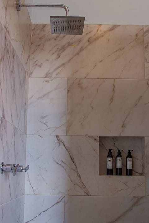 Suite | Bathroom | Designer toiletries, hair dryer, bathrobes, slippers