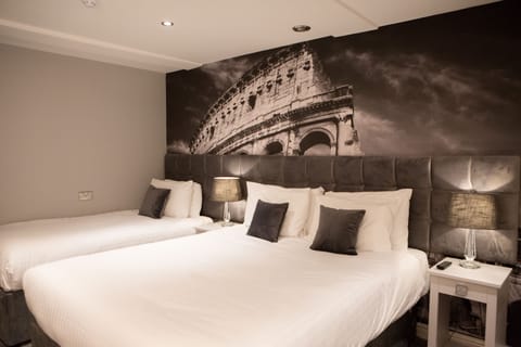 Hypo-allergenic bedding, desk, laptop workspace, blackout drapes