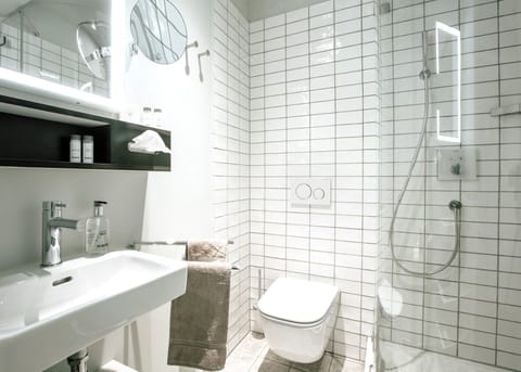 Standard Single Room, 1 Queen Bed | Bathroom | Rainfall showerhead, eco-friendly toiletries, hair dryer, towels