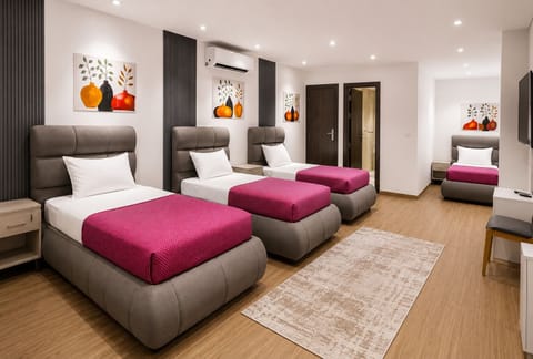 Deluxe Quadruple Room, City View | In-room safe, desk, blackout drapes, WiFi (free)