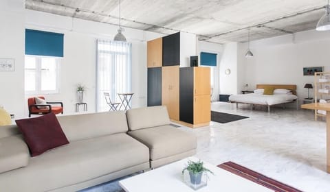 Deluxe Studio with Balcony | Living area | Flat-screen TV