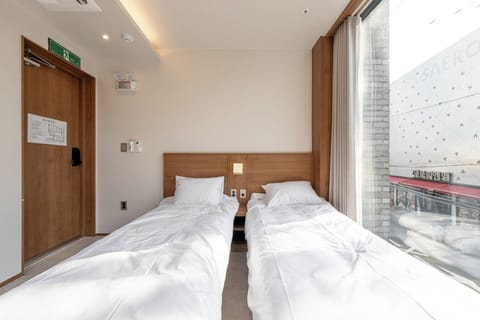Basic Twin Room, 2 Twin Beds, City View (201) | Desk, laptop workspace, WiFi (free)