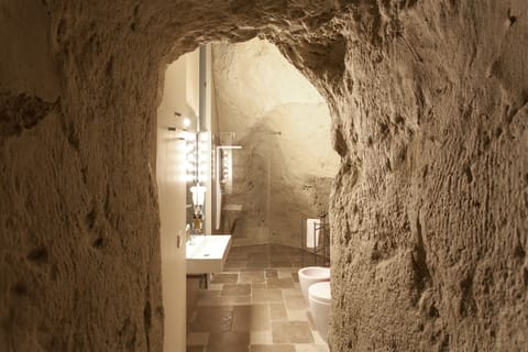 Luxury Studio Suite, Jetted Tub | Bathroom | Hair dryer, towels, soap, shampoo