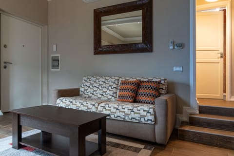 Apartment, 1 Bedroom, Balcony, Lake View | Living area | 30-inch TV with satellite channels