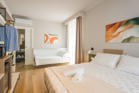 Deluxe Triple Room, Balcony, Sea View | In-room safe, desk, laptop workspace, WiFi (free)