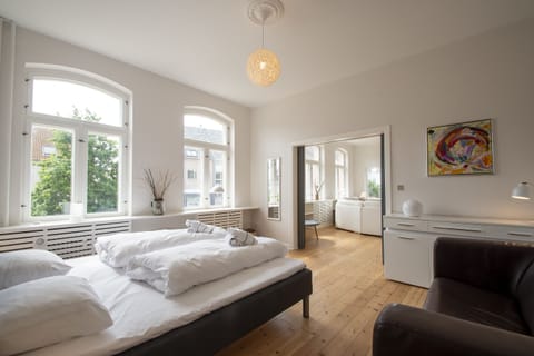 Family Apartment, Multiple Beds | Hypo-allergenic bedding, blackout drapes, free WiFi, bed sheets