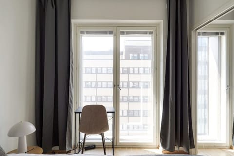 Deluxe Condo, City View | Desk, laptop workspace, blackout drapes, soundproofing