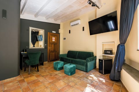 Junior Suite, Garden View | Minibar, in-room safe, blackout drapes, iron/ironing board (on request)