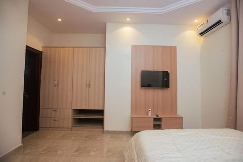 Family Apartment, Balcony, City View | In-room safe, desk, laptop workspace, blackout drapes