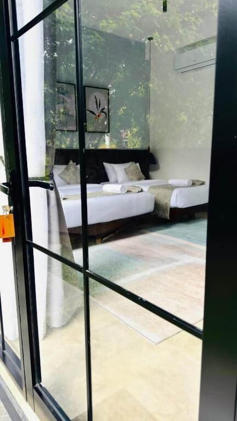 Family Room, Patio, Garden View | In-room safe, blackout drapes, iron/ironing board, WiFi (free)